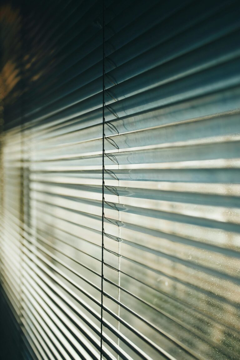 Close up of Venetian blind slats with light coming through