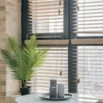 Wooden and white Venetian blinds on a living room window